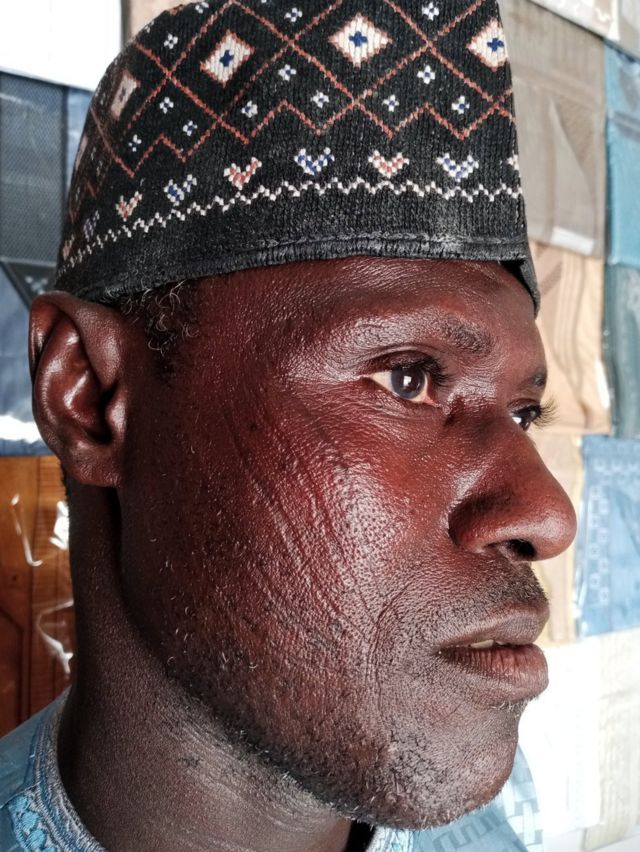 A man wearing a traditional Hausa hat