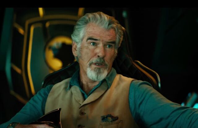 Pierce Brosnan plays Doctor Fate, who has learned sorcery and is in possession of the magical Helmet of Fate.