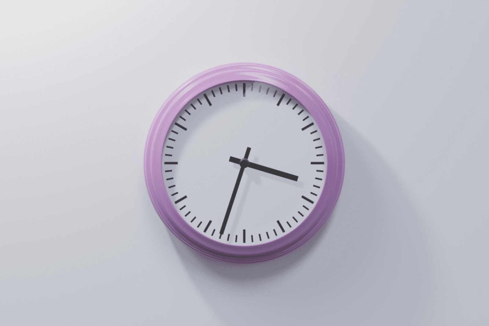 a purple clock on a white wall