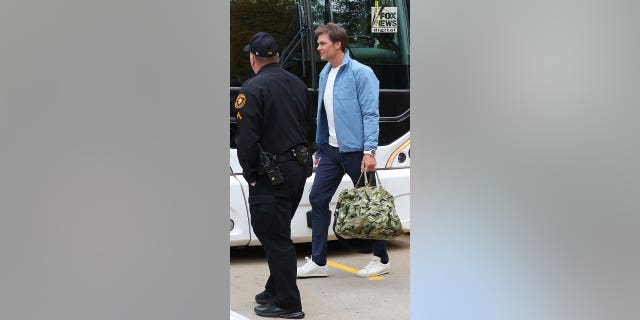 Tom Brady leaves his team hotel on Sunday, October 16, 2022, before his game against the Pittsburgh Steelers.  Tom wasn't wearing his wedding ring.