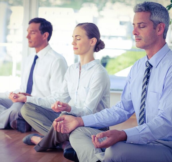 How does yoga in the workplace act on the feeling of stress?