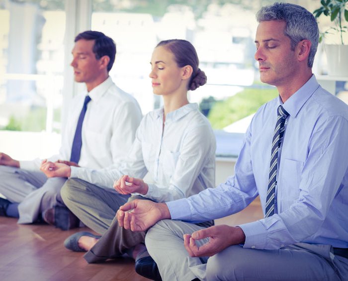 How does yoga in the workplace act on the feeling