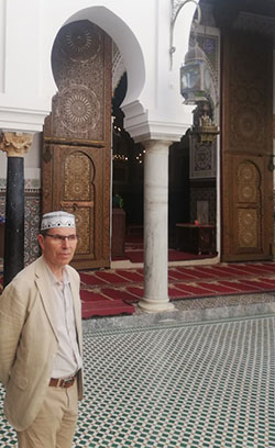 Abd-al-Haqq Guiderdoni in front of the entrance to the mosque containing the mausoleum of Moulay Idris II, son of Moulay Idris 1st, descendant of the Prophet Muhammad, founder of Fez and the Idrisid emirate.