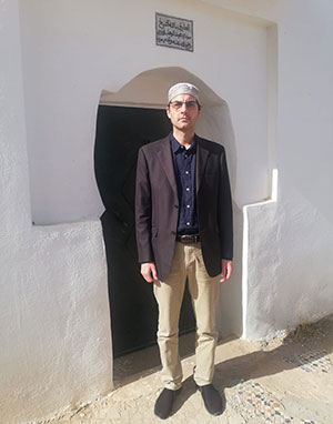 Abd-al-Wadoud Gouraud in front of the mausoleum of Sheikh 'Abd al-Wahhab al-Tâzî, spiritual master and former rector of Al-Qarawiyyin University.
