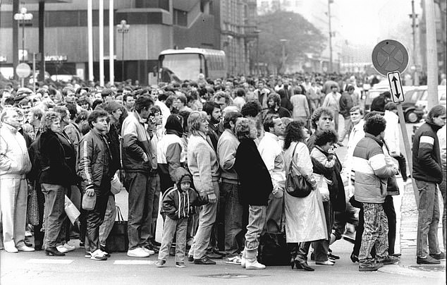 Pictured: Queues at the border crossing the Berlin Wall after it reopened in November 1989. After several weeks of civil unrest, the East German government announced on November 9, 1989 that all citizens of the GDR could visit West Germany and West Berlin.