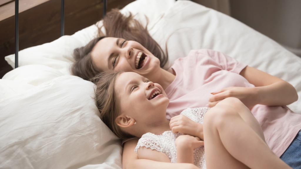 Mom and daughter laughing